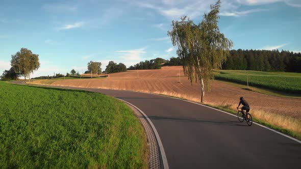 Riding bicycle at sunset. Sunset Cycling