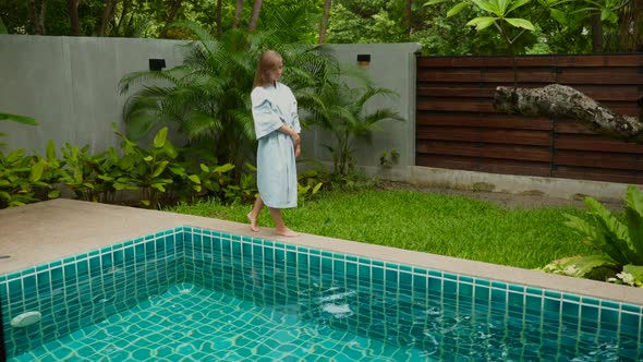 Female Tourist Relax and Tranquility Near Poolside on Vacation