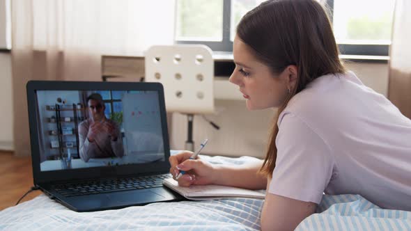 Student Girl with Laptop Learning Online at Home