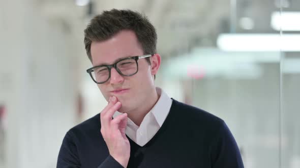 Unhealthy Young Businessman Having Toothache