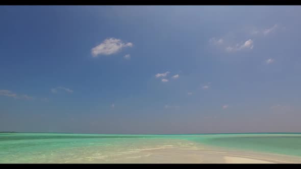 Aerial drone panorama of idyllic coast beach vacation by blue ocean and bright sand background of a 