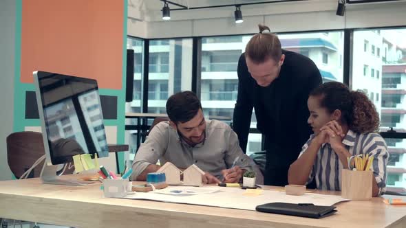 Creative Business People Group Having Conversation at Office Desk in Workplace