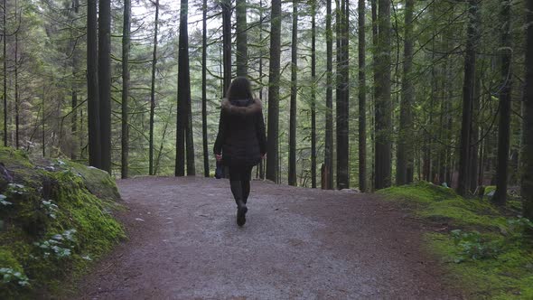 Girl Walking in the Canadian Rain Forest