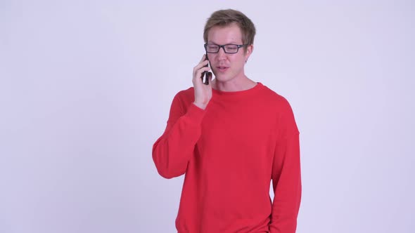 Happy Young Handsome Man Talking on the Phone