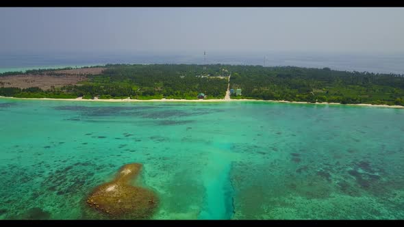 Aerial drone tourism of marine tourist beach holiday by blue lagoon and white sand background of a d