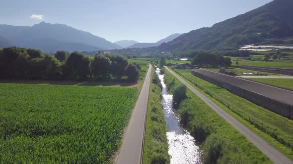 Aerial panoramic view of a biker with views of Sugana Valley, Italy. Drone flying forward