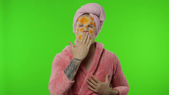 Young Man in Bathrobe with Face Mask Showing Love Heart Sign. Chroma Key