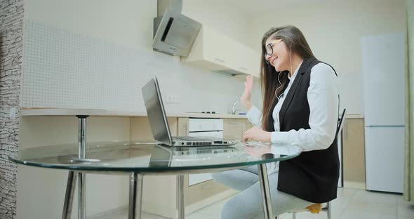 Student with long hair in classic vest with sportive pants