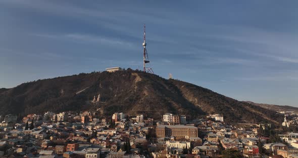 Aerial view of center of Tbilisi under Mtatsminda mountain. Georgia 2022