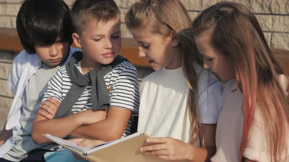 Serious Children in Preschool Reading Books.