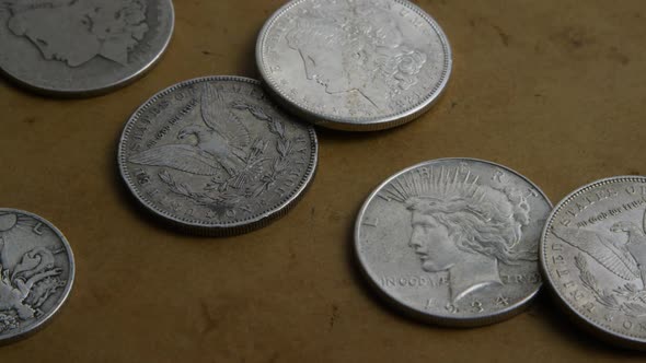 Rotating stock footage shot of antique American coins - MONEY 0058