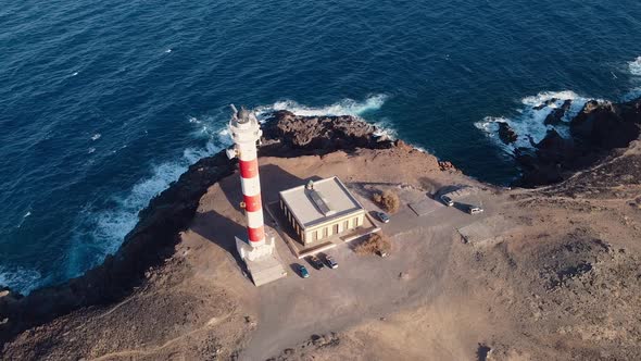 Scenic Aerial View of a Lighthouse in Volcanic Coastline Landscape. Tenerife, Canary Islands, Spain