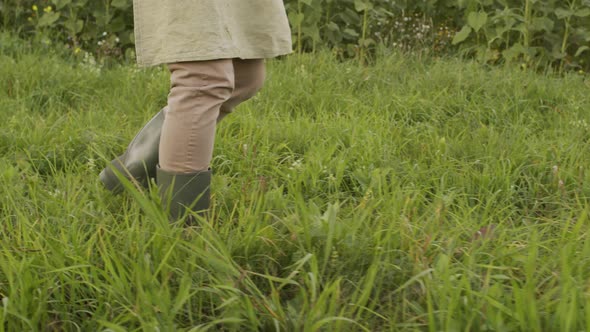 Unrecognizable Agronomist Legs Walking In Field