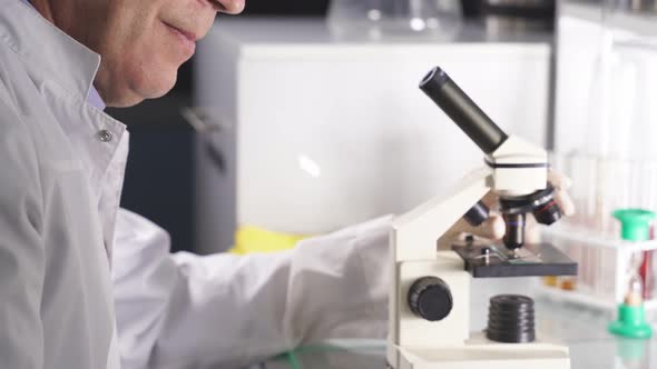 High Level Laboratory Scientist Examining Samples Test Tubes