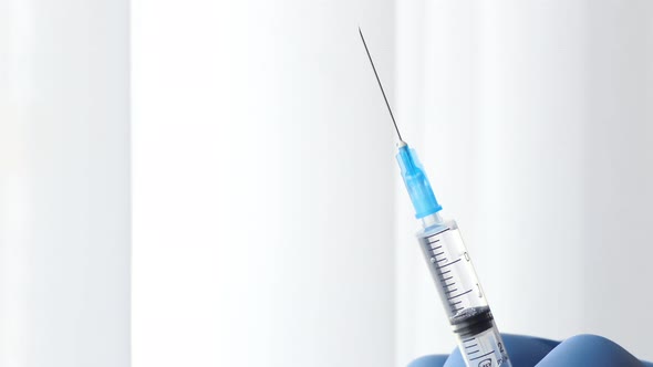 Close Up of Injection Liquid Being in Syringe