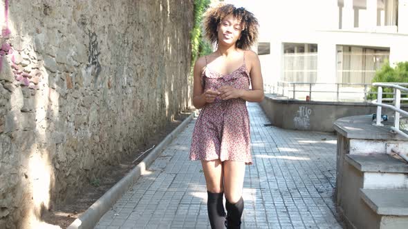 Contemporary Young Woman in Dress on Street