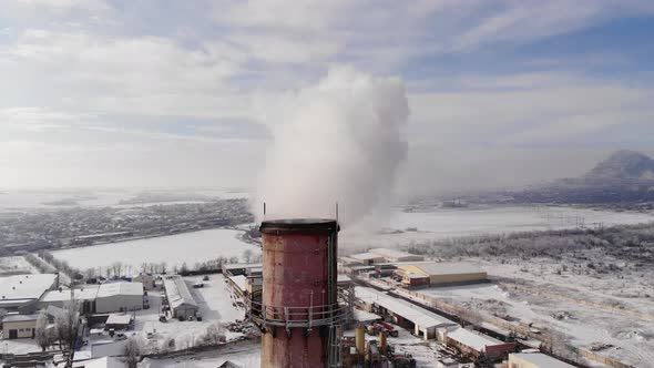 Close Up View of CHP Chimneys with Smoke in Evening Light