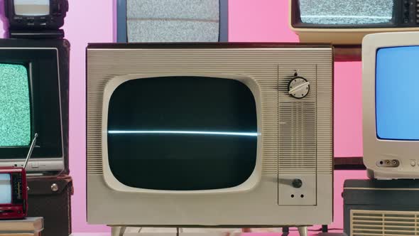 Old Televisions with Grey Interference Screen on Pink Red Neon Background