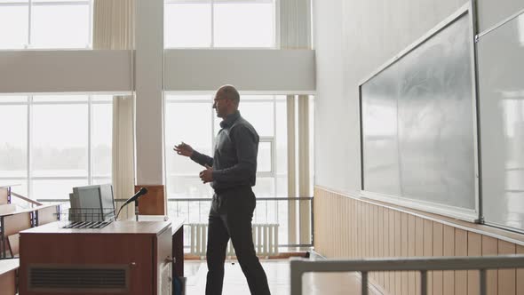 University Professor Giving Lecture at Blackboard