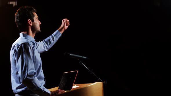 Male business executive giving a speech