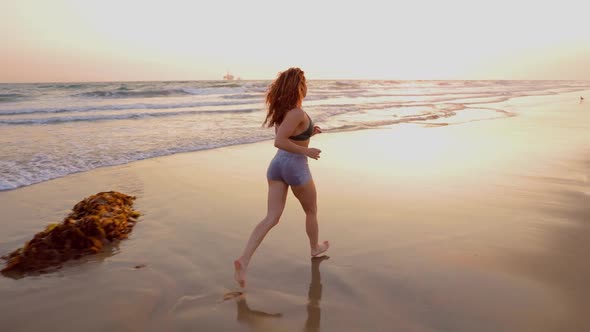 Athletic Woman Working Out At The Beach