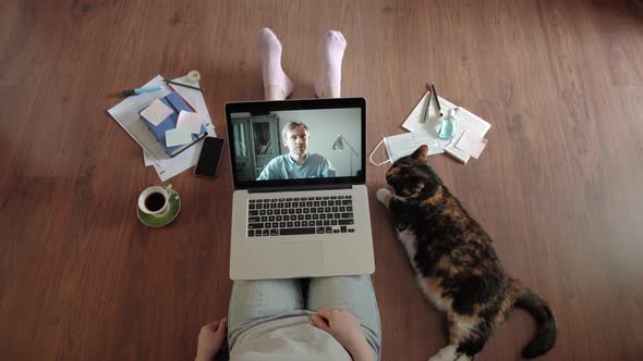 Young Woman Smiling While Videoconferencing at Home During Coronavirus Self Quarantine