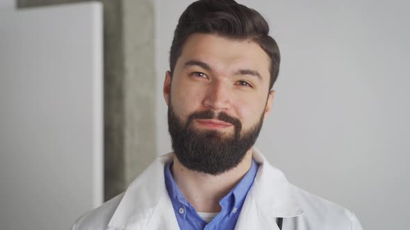 Caucasian Male Doctor Looking at Camera with Friendly Smile Close Up Portrait