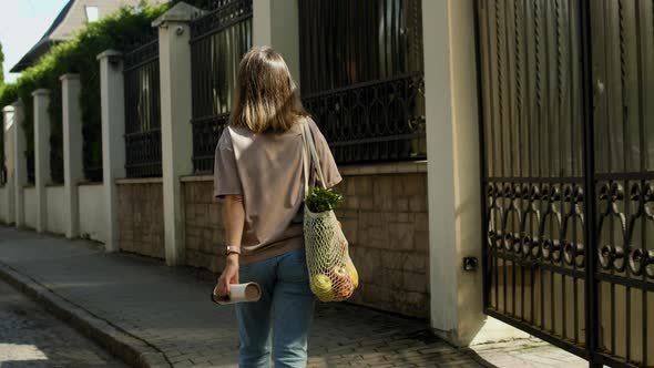 Conscious consumption concept. Woman with eco string bag