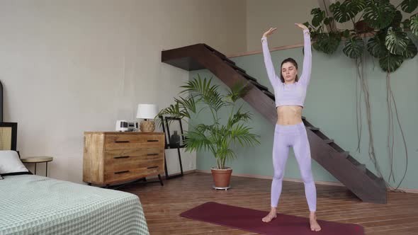 Young Woman Doing Gymnastics at Home