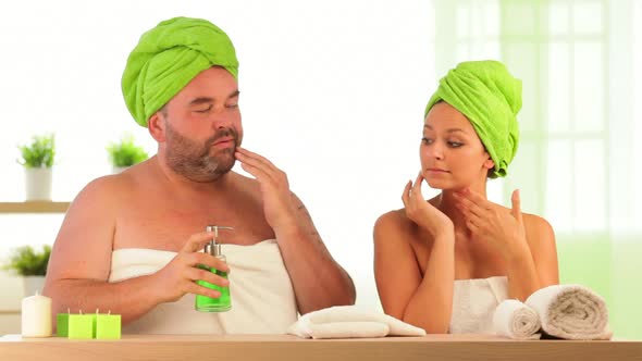 Overweight Man and Slim Woman Beauty Treatment at Health Spa