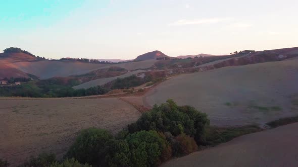 Aerial View of Tuscany Cultivated Hills at Sunrise Val D'orcia