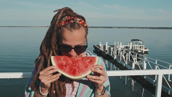 Girl Eating Piece of Watermelon