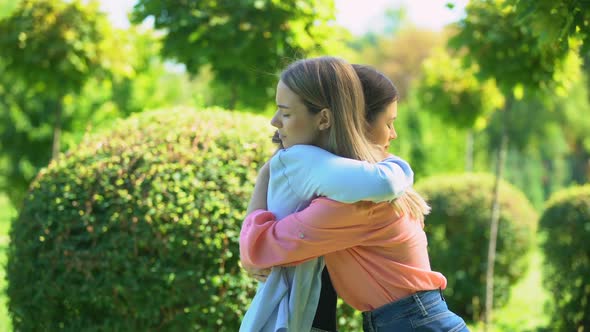 Two Women Hugging Outdoor, Saying Good-Bye, Friendship, Trusting Relationship