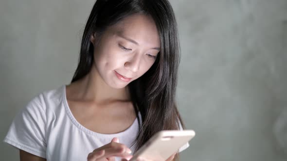 Woman listen to music on cellphone at outdoor