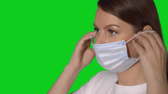 Young Caucasian Beautiful Woman Put on Protective Face Mask