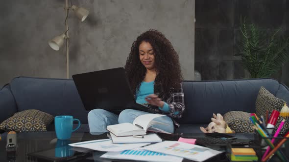 Black Freelance Woman Working on Laptop at Home