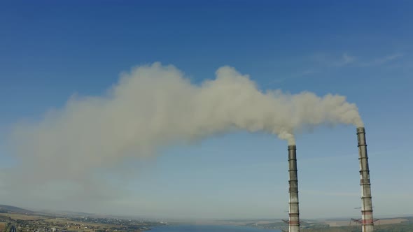 Aerial Drone View of Emission to Atmosphere From Industrial Pipes