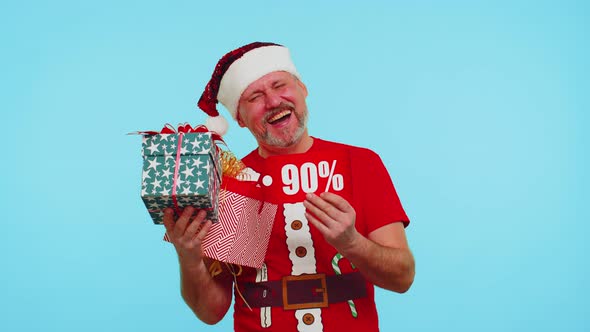 Man in Red Christmas Tshirt Showing Gift Box and 90 Percent Discount Inscriptions Banner Text Note