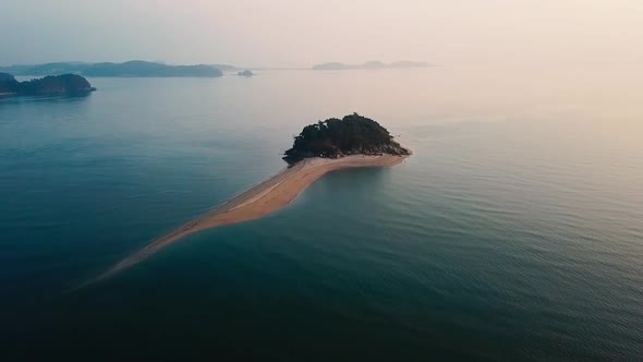 Drone flying to the island