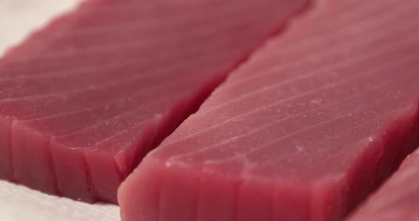 Close up View Of Red Tuna Fish Fillet For Sashimi In The Kitchen Of A Japanese Restaurant. - slider