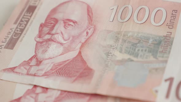 Hand takes denominations of 1000 dinars 4K 2160p 30fps UltraHD  footage - Taking Serbian banknotes f