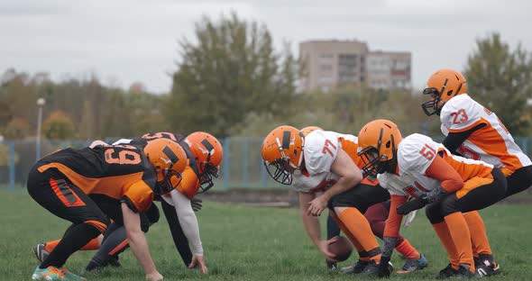 American Football Football Team in the Game Training Aggressive Opposition During the Game Battle of