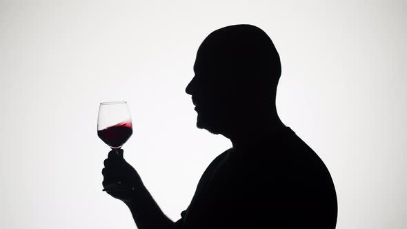 Man Drinking Wine on White Background