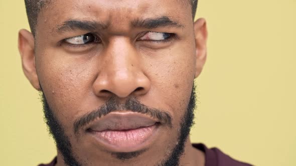 Slomo Extreme Closeup Thoughtful Metis Man with Hazel Eyes Wearing Sporty Clothes Looking at Camera