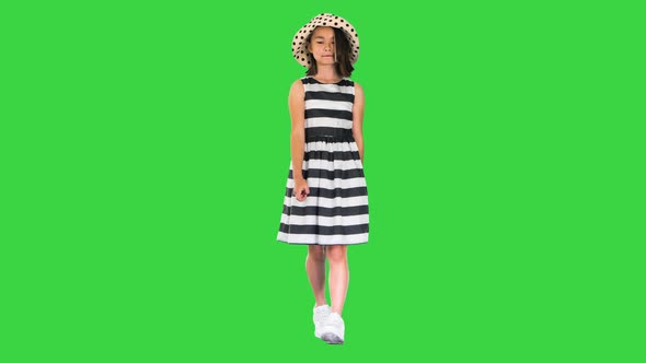 Beautiful Asian Girl in Sundress and a Summer Hat Walking on a Green Screen Chroma Key