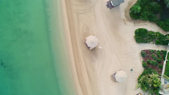 Aerial view of an empty beach with white parasol, U.A.E.