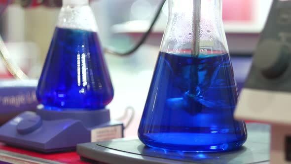 Blue Samples In Flasks