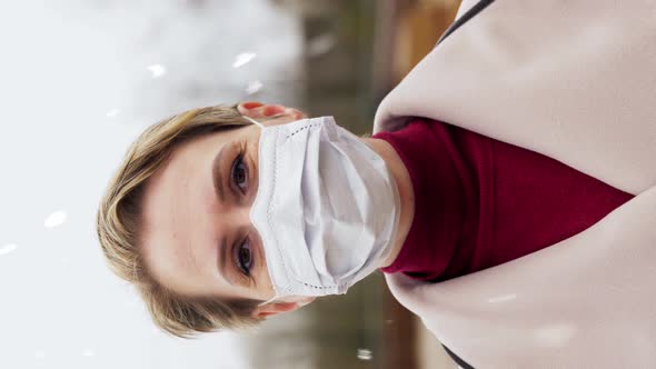 Woman Wearing Protective Medical Mask in Winter