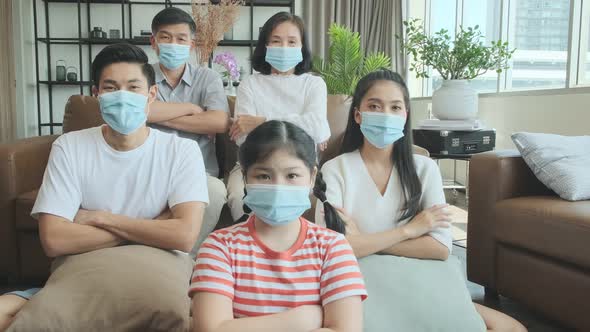 portrait of asian family multi generation wearing surgical facial mask stay quarantine