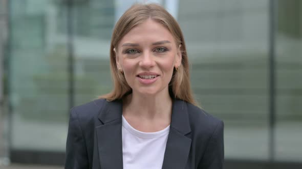 Young Businesswoman Talking on Online Video Call Outdoor